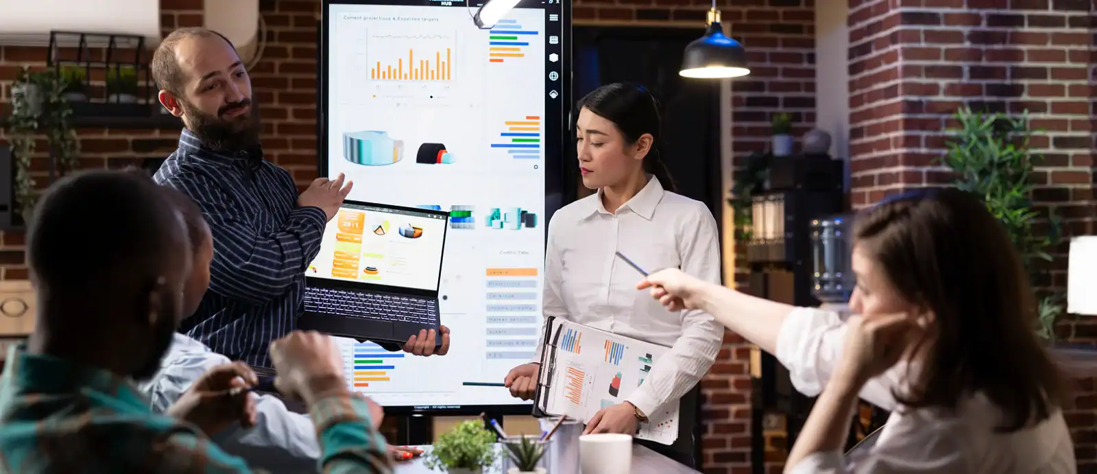 professionals-present-financial-charts-meeting 1