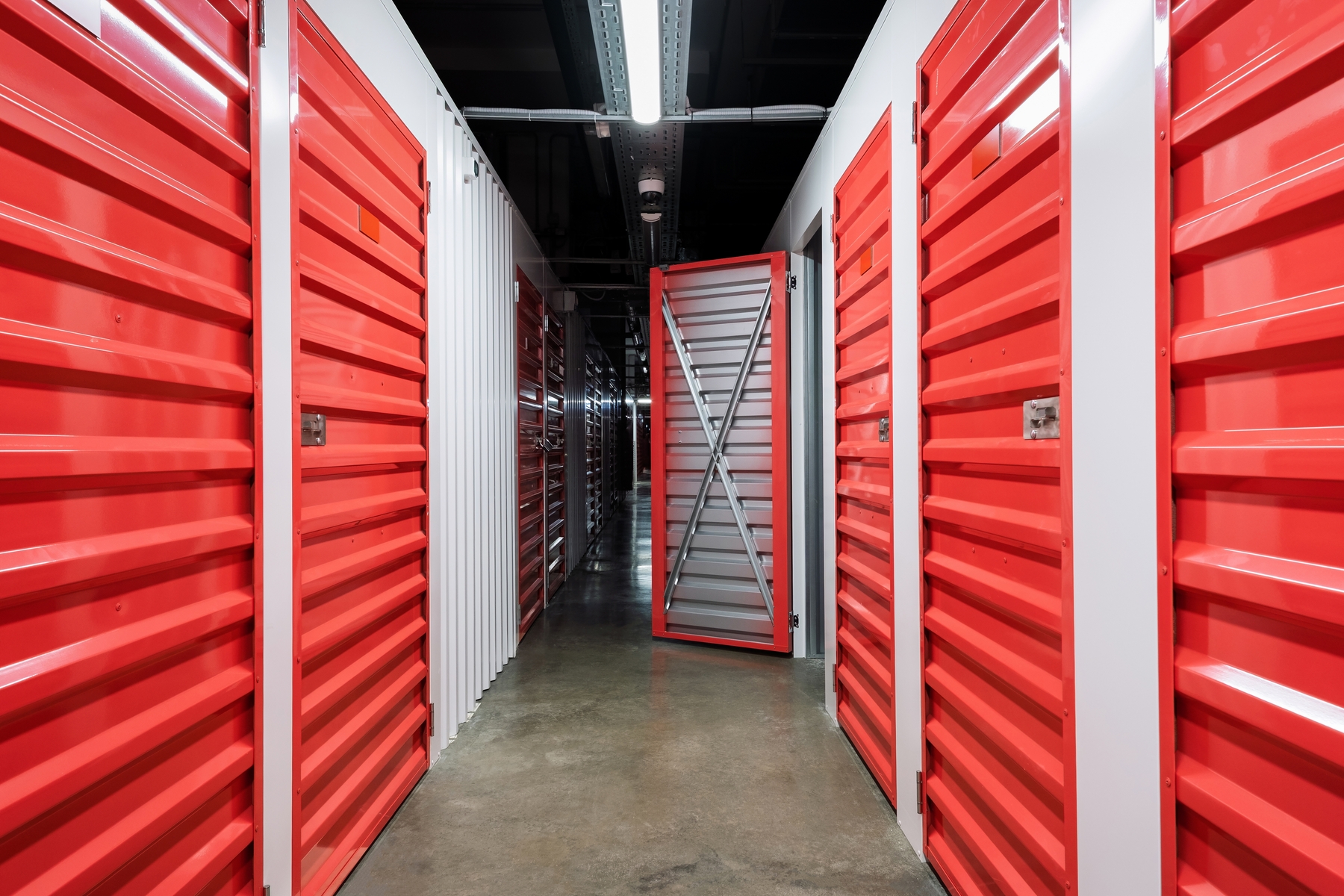 Storage,Corridor,Warehouse,With,Open,Door.,Self,Storage,Facility,,Red